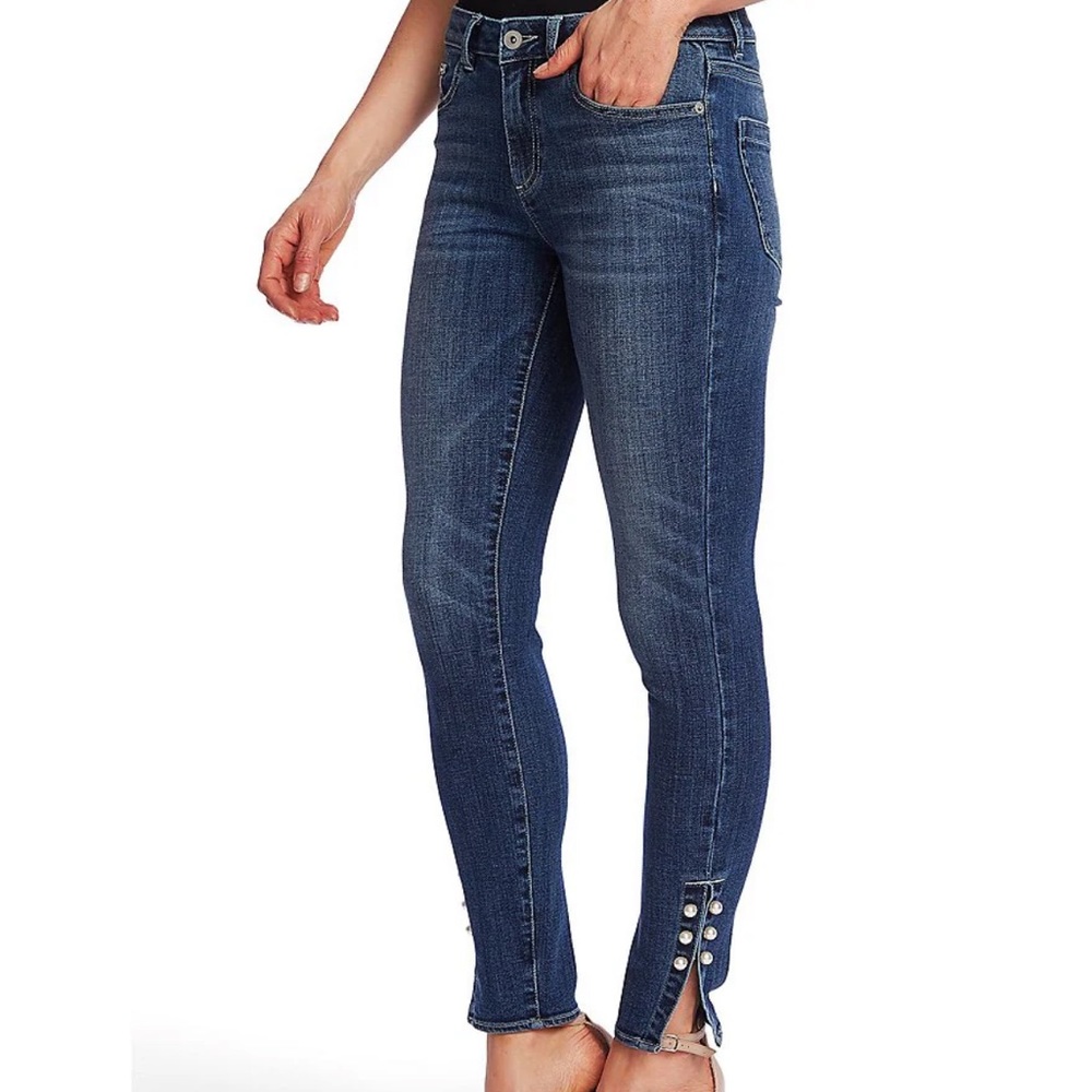 Cece jeans size 2 with pearls on the bottoms.
